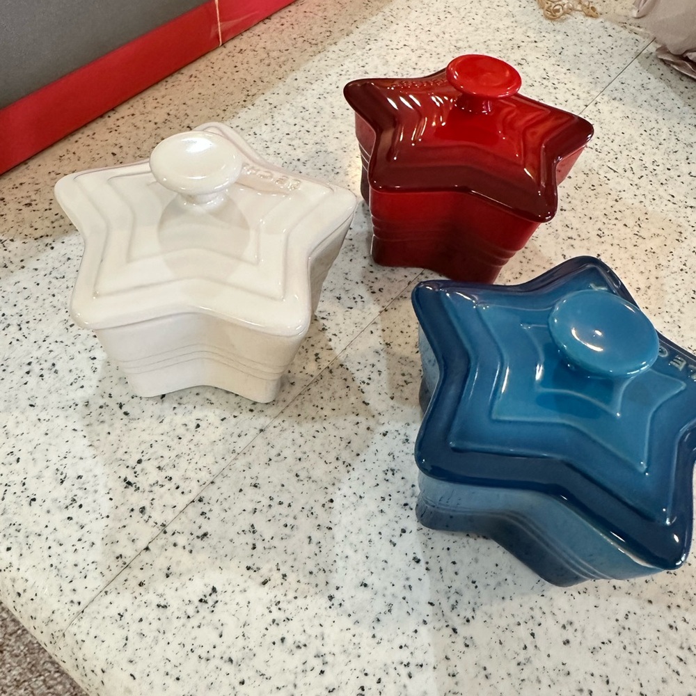 Le Creuset Star-Shaped Ceramic Canisters in Red, Blue, and White